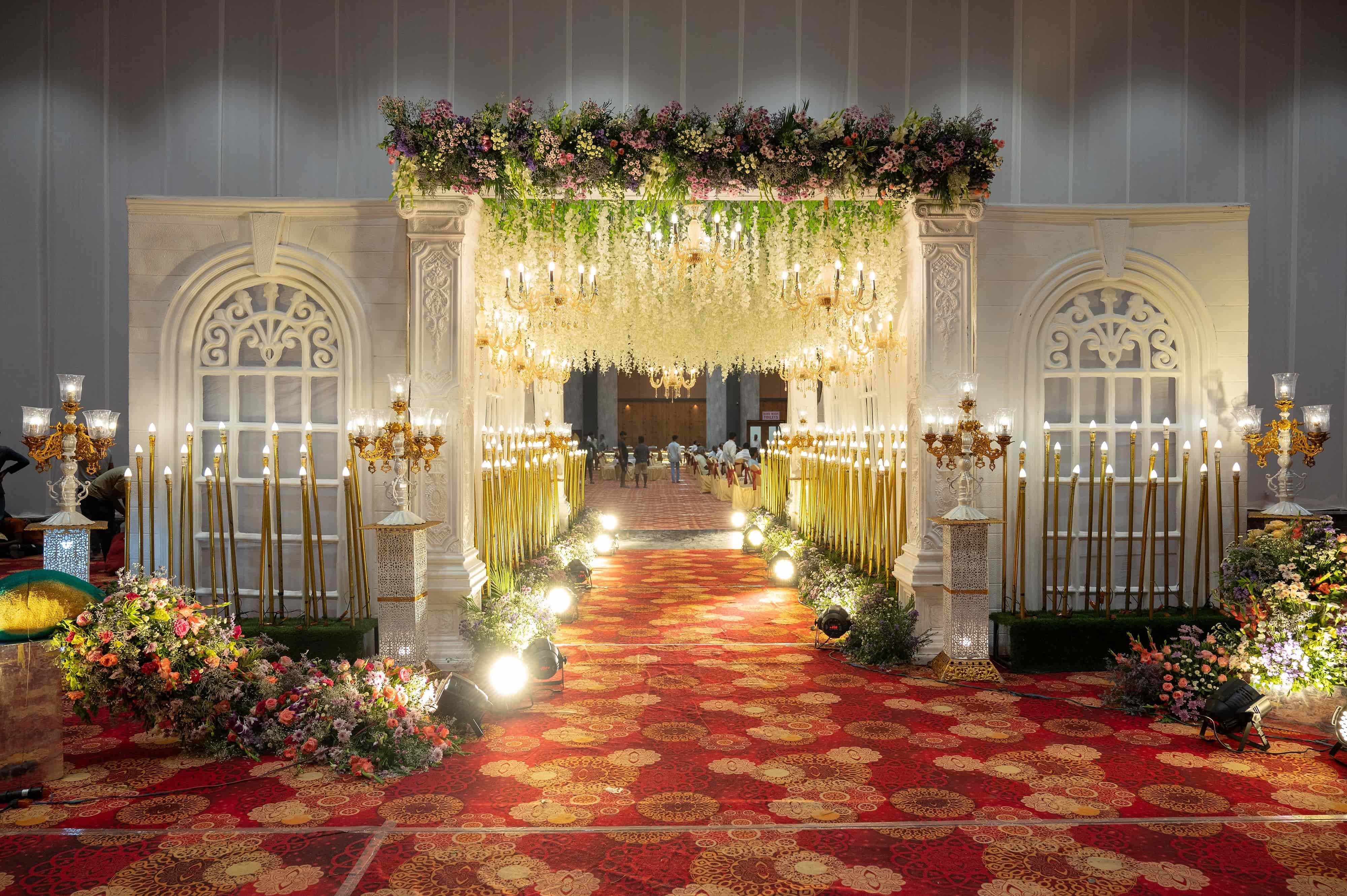 Floral wedding entrance arch and decor at VRC Convention
