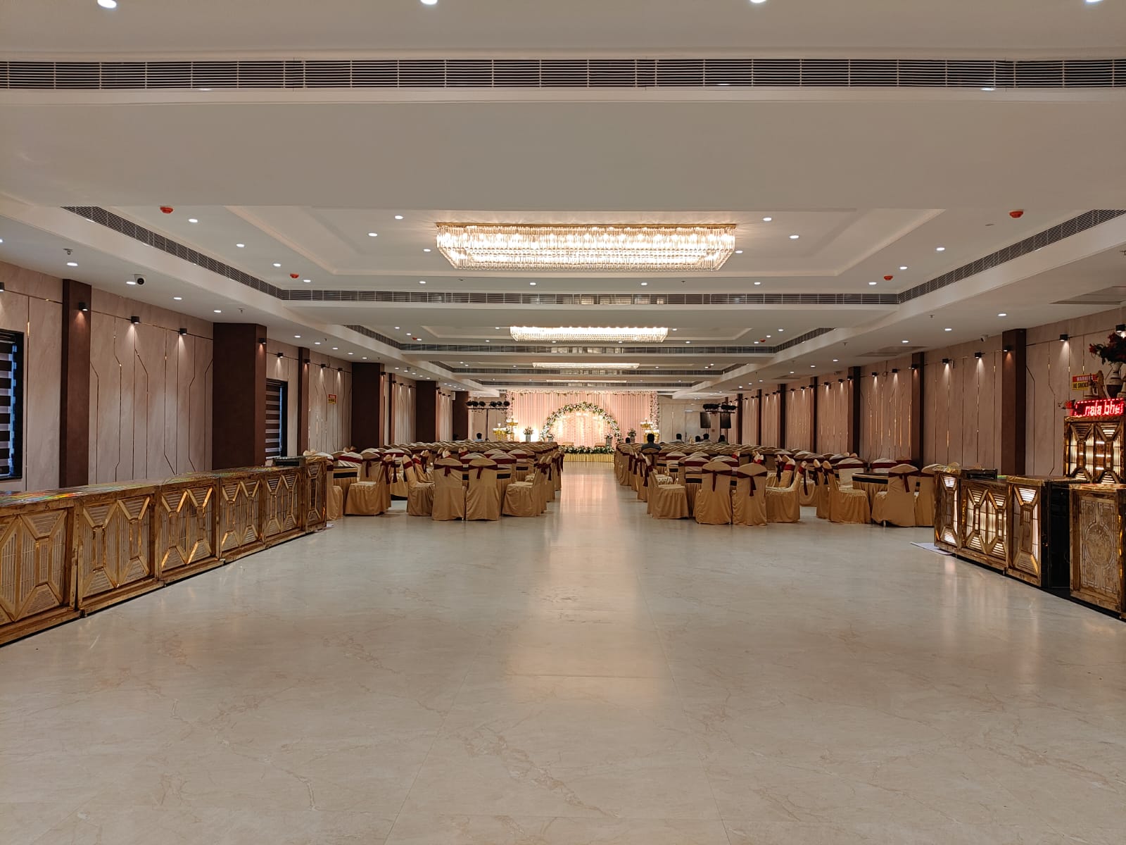 Banquet hall at VRC Convention with chandeliers, ready for an event